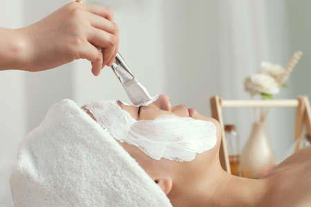 	A young woman enjoying spa mask	