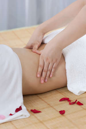 	A young woman enjoying massage	の写真素材