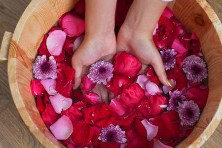 	Hands spa with flowers for young lady	