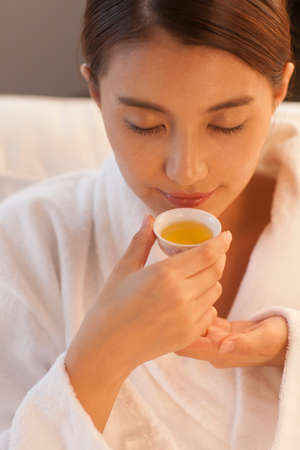 young woman drinking tea