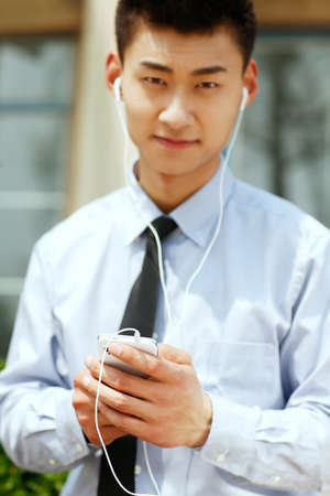 Businessman listening musicの写真素材