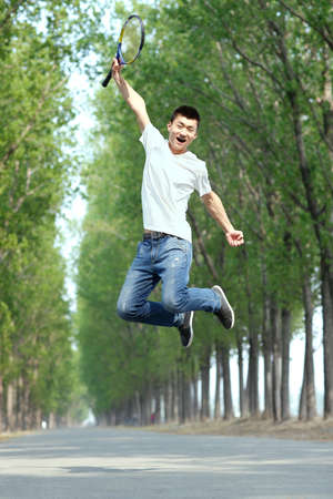 The young man jumpingの写真素材