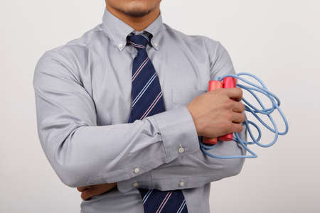 A business man with rope skippingの写真素材