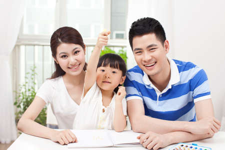 Family drawing togetherの写真素材