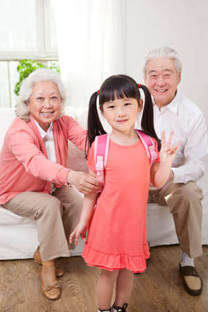 Senior couple with granddaughterの写真素材