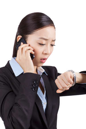Portrait of a businesswoman looking at her watchの写真素材