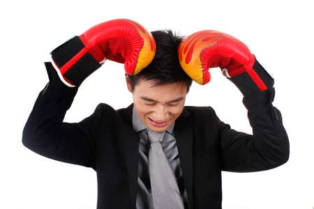 Young businessman with red boxing gloves
