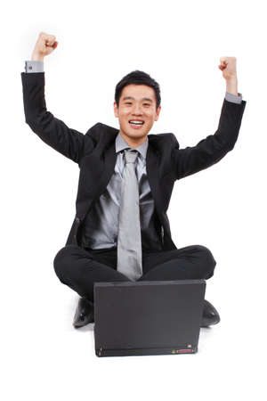 Young businessman relaxed at workの写真素材