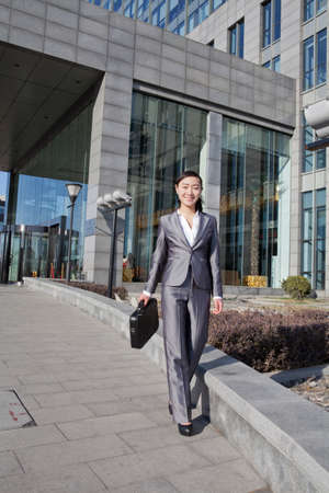 Businesswoman walking to workの写真素材