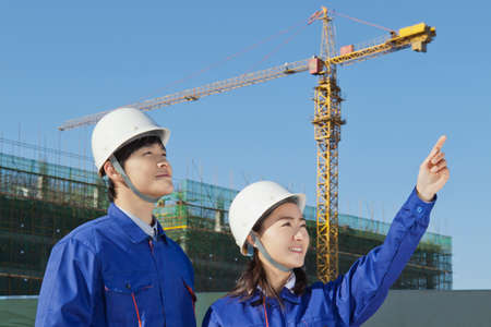 Engineers working at construction field