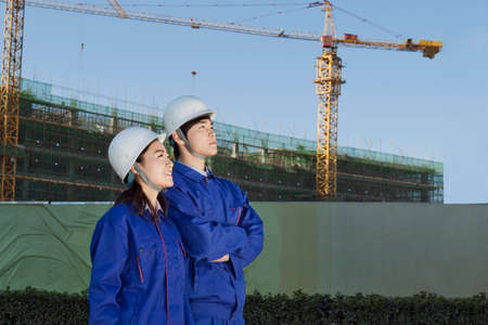 Engineers working at construction fieldの写真素材