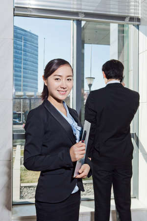 Businessman and businesswoman working happily