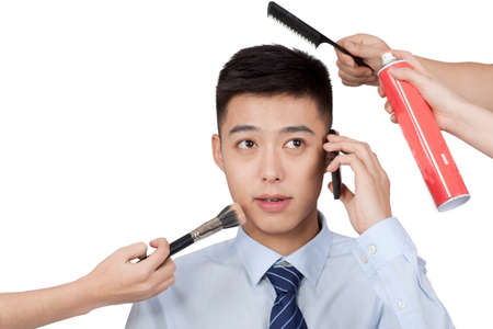 Portrait of a young man talking on cell phoneの写真素材