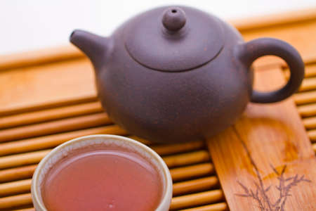 Iron teapot and tea close-upの写真素材