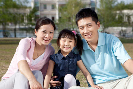 Happy family in parkの写真素材