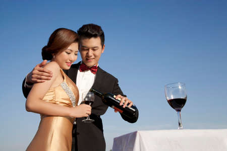 Wearing evening dress fashion of young man and woman in PARTYの写真素材