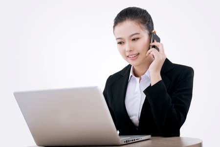 Oriental fashion business woman using computerの写真素材
