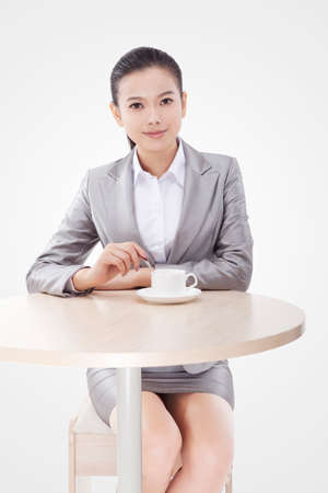 Business woman drinking coffeeの写真素材