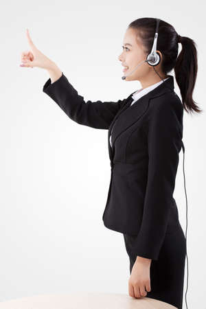 Oriental business lady wearing headsetの写真素材