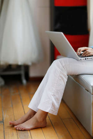 Fashion young woman using a laptopの写真素材