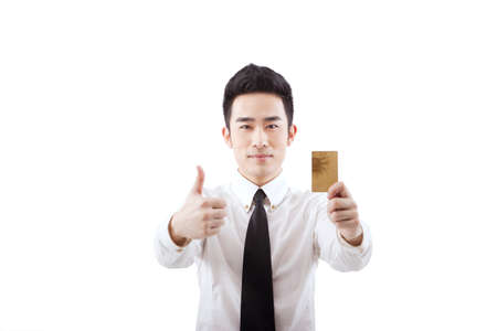 Business people holding a credit cardの写真素材
