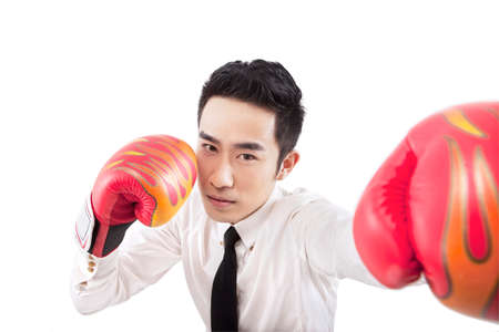 Business people and boxing glovesの写真素材
