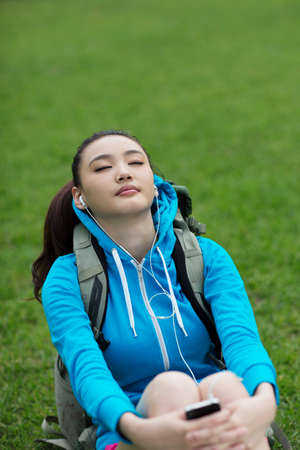 Young woman with backpack in outdoor