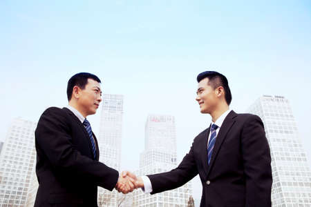 Business people shaking hands in outdoor