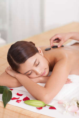 A person lying on a bedの写真素材