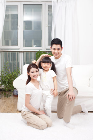 Parents measuring height for daughter high quality photoの写真素材