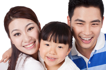Portrait of a happy family with one child high quality photoの写真素材