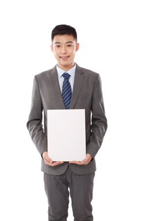 Portrait of young bisiness man holding whiteboard high quality photoの写真素材