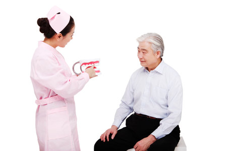 Dental clinic staff to explain teeth matters needing attention high quality photoの写真素材