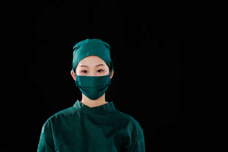 Portrait of a young female surgeon looking at the camera