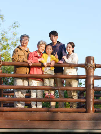 Happy family of five in the outdoor group photo high quality photo