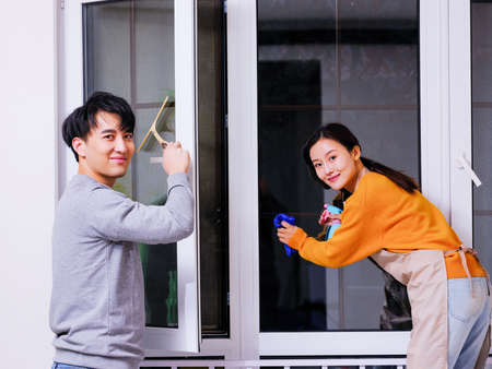 Young couples do housework together high quality photoの写真素材