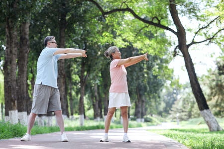 Old couple sports in the park high quality photoの写真素材