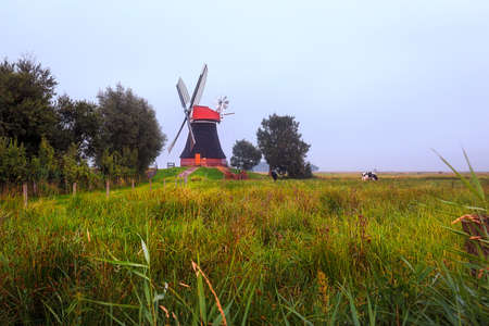 The windmill Wynhamster Kolk on a foggy dayの写真素材
