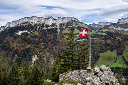 The flag of Switzerland in the Alps near Wasserauenの写真素材