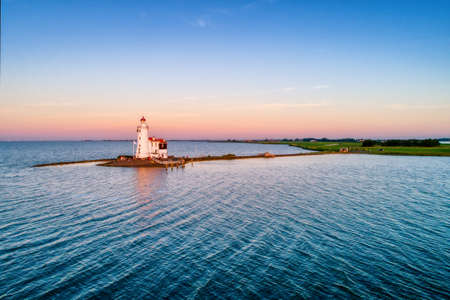 The lighthouse Paard van Marken on the dutch peninsula Marken on the Ijsselmeer. It was built in 1839.の写真素材