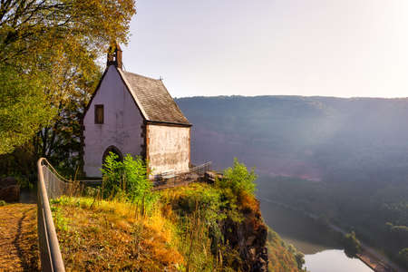 The St.-Michaels-Kapelle near Taben-Rodt over the river Saarの写真素材