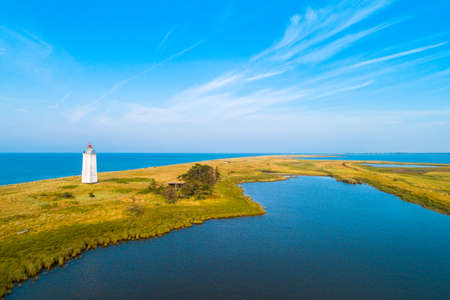 The lighthouse Hyllekrok Fyr on the danish island Lolland. The lighthouse was build in 1905.の写真素材