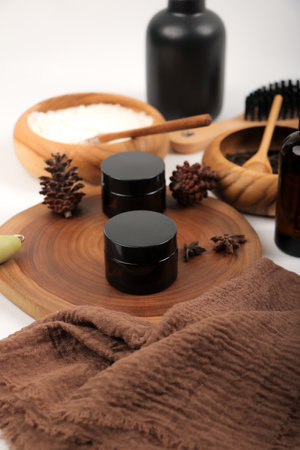 Set of spa products on wooden board on white background, closeupの写真素材