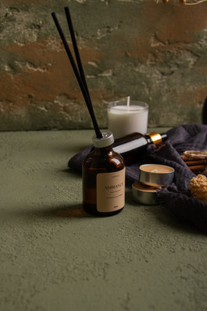 Aromatherapy and spa setting on green textured background.