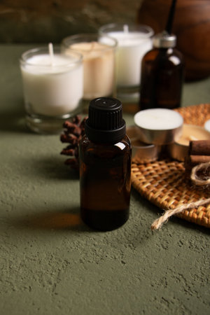 Aromatherapy essential oil in bottle on grey textured backgroundの写真素材