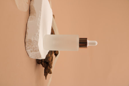 Cosmetic bottle with pipette on beige background, closeupの写真素材