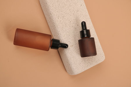 Cosmetic bottles on a beige background. Skin care concept.の写真素材