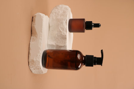 Set of cosmetic bottles with dispenser on toilet paper, closeupの写真素材