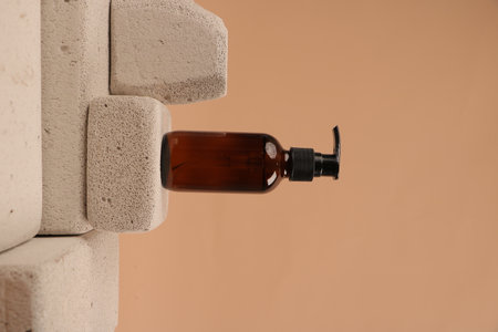Cosmetic bottle with pipette on beige background, closeupの写真素材