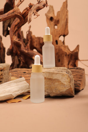 Cosmetic bottle with pipette on wooden background. Natural skin care concept